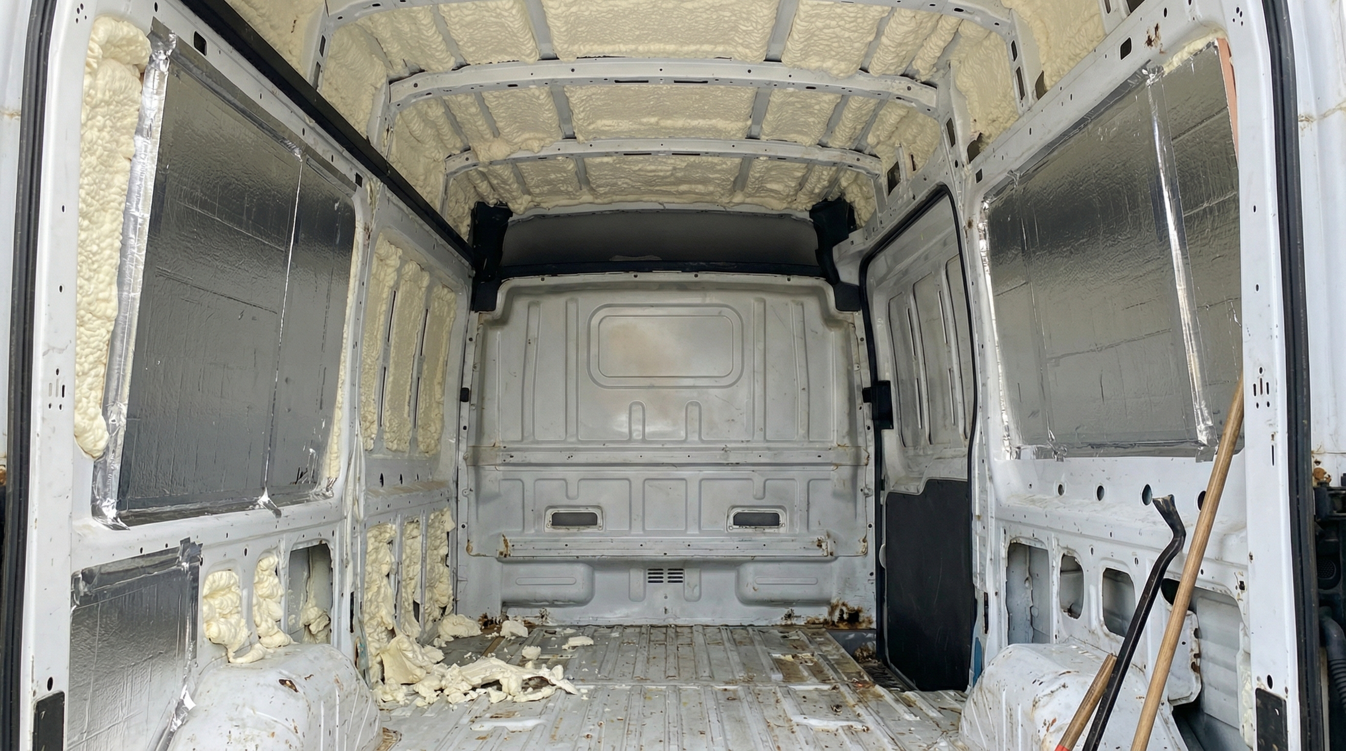 Insulation installed — spray foam and rigid board